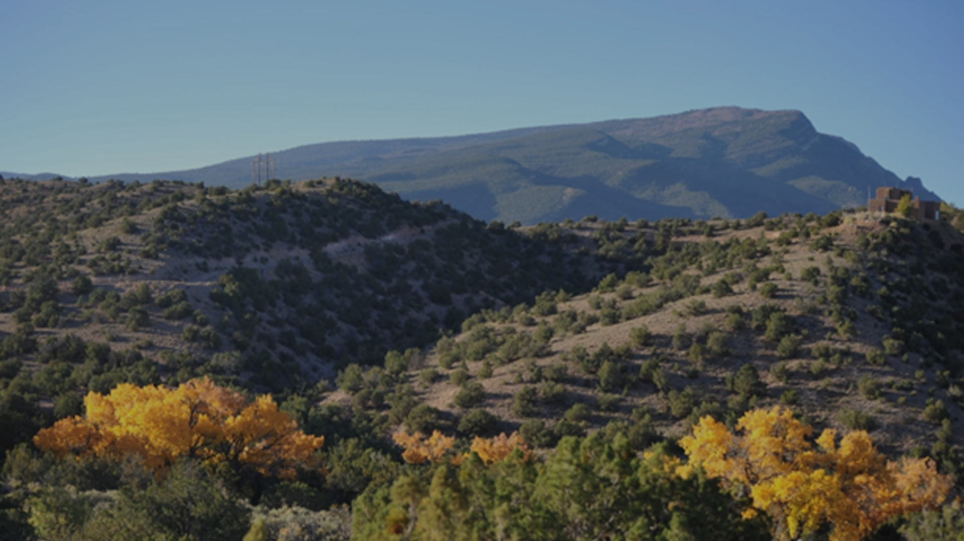 Scenic mountainous landscape with clear blue sky.