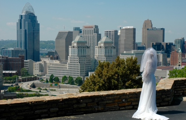 Bride overlooking the city's skyline